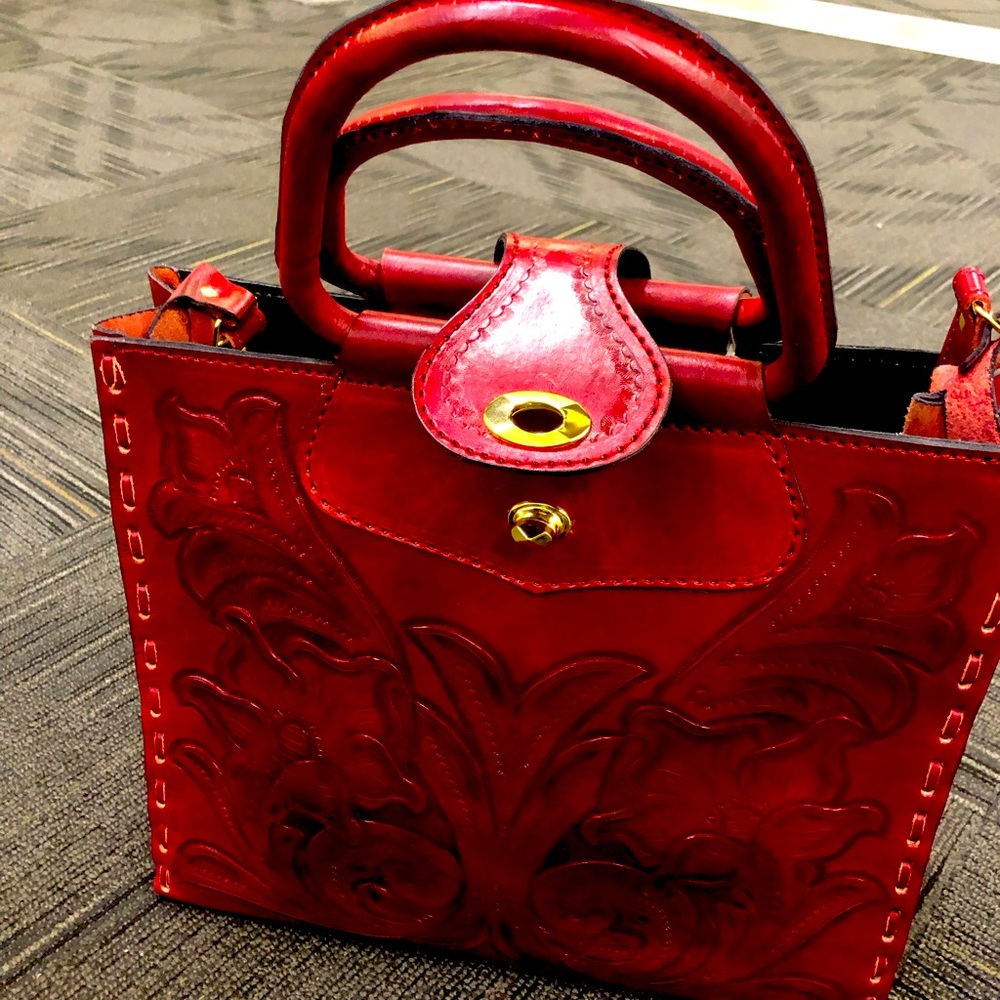 Beautiful red leather tote with Mexican detail.